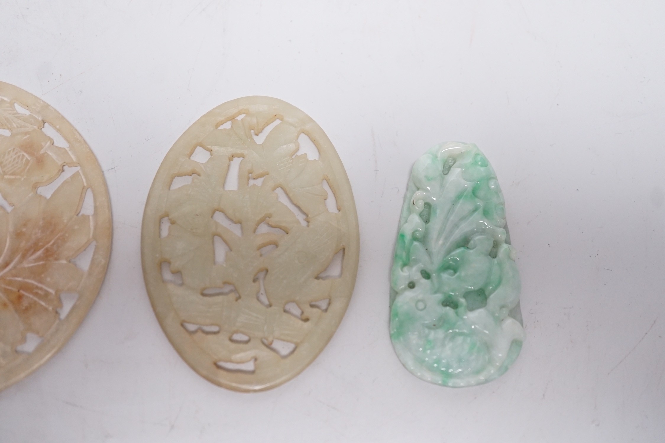 Two Chinese jadeite carvings, two pierce hardstone plaques and a malachite carving (5)